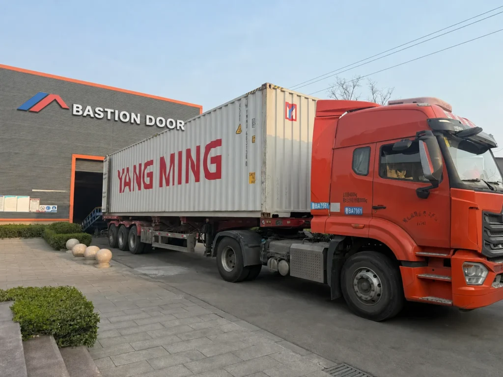 Yang Ming export container truck collecting a door shipment from Bastion Door factory