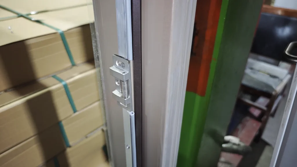 Hospital door frame, strike preparation and perimeter seal detail